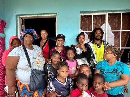 Rosemarie Bent in a photo with persons using her home in Flagaman, St Elizebeth, as a shelter. Those persons had nowhere to go as they prepared for the Category 5 Hurricane Melissa which is expected to make landfall today. 