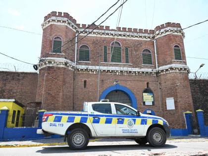 A police patrol car passes the Tower Street Adult Correctional Centre in downtown Kingston on March 14, 2024.