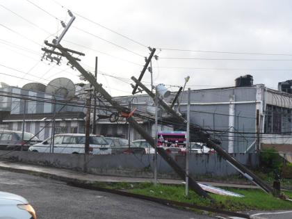 Toppled JPS utility poles are seen along Hargreaves Avenue in Mandeville after Hurricane Melissa swept through Jamaica last month.