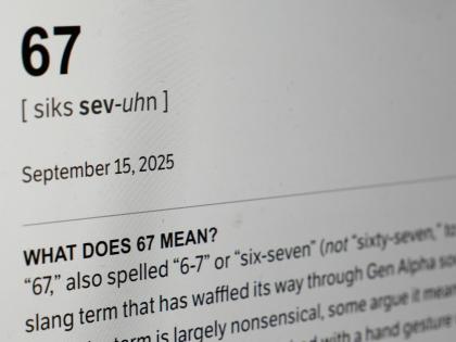 This Dictionary.com page shows the newest word of the year “6-7” on a computer screen. 