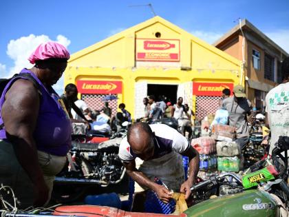 Residents of Black River and surrounding communities descend on the shopping district of the St Elizabeth capital in search of food and other supplies last Thursday.