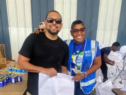 Sean Paul and Marsha Burrell-Rose, marketing, PR and missions manager at Food For The Poor (FFTP) Jamaica keep up the positive energy as the teams worked together to put together relief packages. VP Music Group has now partnered with FFTP to help rebuild J