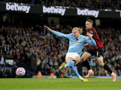 Manchester City’s Erling Haaland scores his sides first goal during the English Premier League match against Bournemouth in Manchester, England, yesterday.