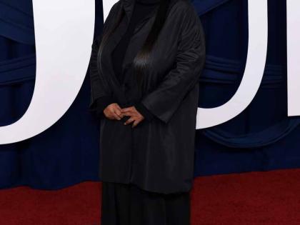 British Make-up Artist Pat McGrath, dressed in all-black with a jewelled headband, paid tribute to her mother Jean McGrath as she collected her Woman of the Year award.