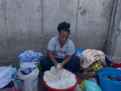 Rose Heights resident Cherry doing her laundry in the proximity of the Sangster International Airport in Montego Bay, St James.