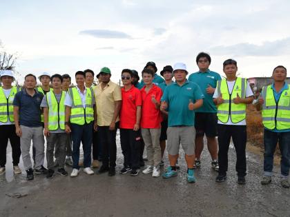 Members of the Chinese community out of western Jamacia with Floyd Green, member of parliament for St Elizabeth South Western, during a visit on Wednesday to Parottee in St Elizabeth, one of the areas hit hardest by Hurricane Melissa