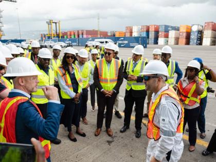David Liner, executive vice president and chief operating officer, Excelerate Energy (2nd left) in conversation with Dr Christopher Tufton, minister of health and wellness at the Kingston Freeport Terminal, as they gather to welcome the arrival of Exceler
