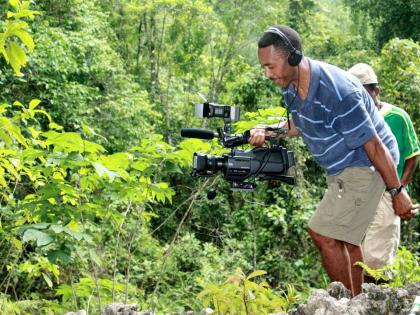 In this file photo, Jamaica-born filmmaker, Roy T. Anderson, capturing footage for his film, ‘Akwantu – The Journey’, on location at the Peace Cave in Accompong, St Elizabeth. Anderson is spearheading the ‘Let’s Rebuild Jamaica Strong’ fundrais
