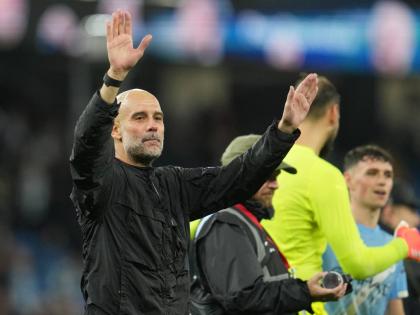 Manchester City’s head coach Pep Guardiola leaves the field at the end of the English Premier League  match between Manchester City and Liverpool in Manchester, England, yesterday.