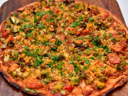 The roasted veggie flat pizza layers seasonal vegetables on a handmade, wholegrain base — a lighter take on pizza that’s as wholesome as it is indulgent.