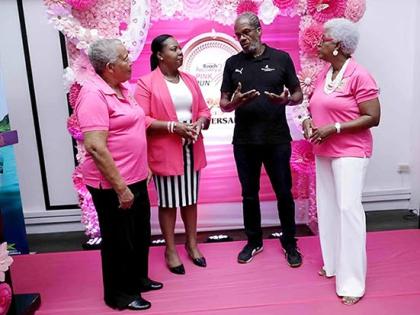 Over the past 25 years, the Pink Run has grown into Jamaica’s flagship breast cancer fundraiser. Alfred Francis, managing director, Running Events Jamaica (second right), explains this year’s New Kingston route to Carolind Graham (left), chairperson, J