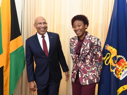 Patrick Allen, Governor General of Jamaica (left) shares a light moment with Tiana Dinham (right) after she was named the 2026 Rhodes Scholar on November 13, 2025 at King’s House.