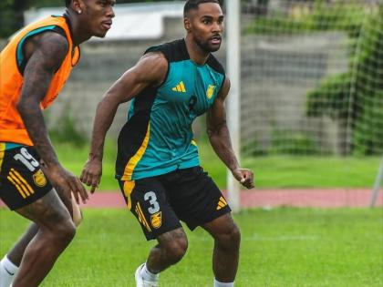 Reggae Boyz Dujuan ‘Whisper’ Richards (left) and debutant Rico Henry facee off during a training session in Trinidad and Tobago earlier this week.