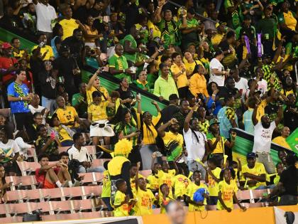 Reggae Boyz fans celebrate after Jamaica scored a goal against Bermuda at the National Stadium on October 14.