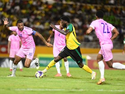 Reggae Boy Shamar Nicholson (second from right) in action against Bermuda’s Dante Leverock (left) during the Jamaica versus Bermuda World Cup Qualifier at the National Stadium  on Tuesday, October 14. 