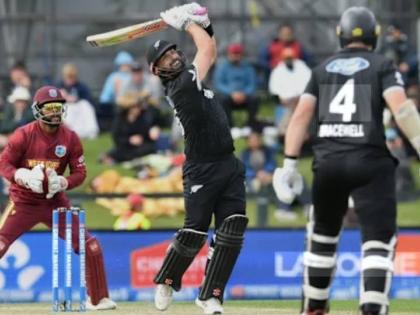 Daryl Mitchell on the go during his match-winning century against the West Indies.
