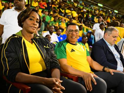 Prime Minister Dr Andrew Holness (second left) and his wife, Speaker of the House of Representatives Juliet Holness, support the Reggae Boyz.