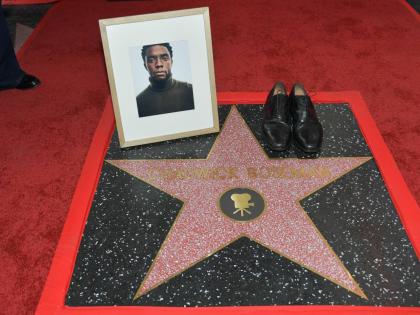 Actor Chadwick Boseman’s shoes and portrait are displayed on his newly unveiled star during a posthumous Hollywood Walk of Fame ceremony in Los Angeles on Thursday.
