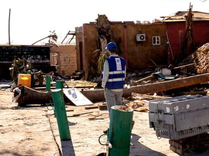 A UNDP team member assesses damage in Parottee, St Elizabeth, following Hurricane Melissa.