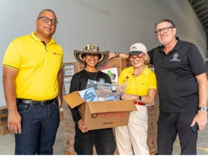 From left: Perrin Gayle, CEO of NCB Foundation; Kathy Calderon, missions manager at Global Empowerment Mission (GEM); Thalia Lyn, chair of NCB Foundation and Lyn Family Trust; and Michael Capponi, founder and president of GEM, prepare relief packages for d