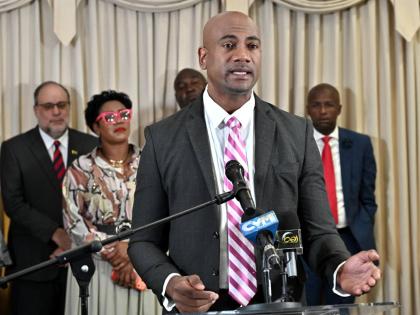 Opposition Spokesman on Health Dr Alfred Dawes addresses a press conference on Tuesday as other People’s National Party officials look on.