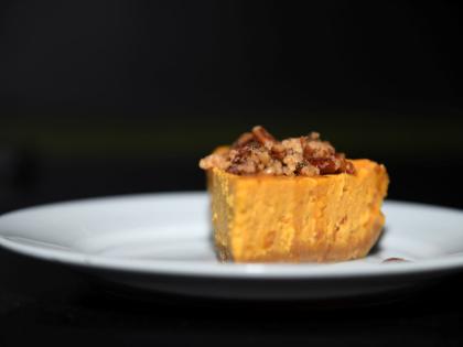 Here is a closer look at the island-spiced pumpkin cheesecake topped with roasted pecans.