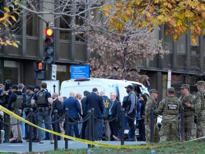 Emergency personnel gather in a cordoned off area where National Guard soldiers were shot near the White House Wednesday, November 26, 2025, in Washington. (AP Photo/Mark Schiefelbein)
