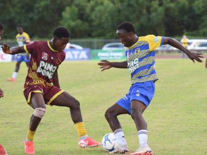 Maggotty High’s Roshane Lewis (left) challenges Rusea’s High’s Omarion Jemmison during their Group One daCosta Cup second-round match at the Montego Bay Sports Complex on Saturday, October 11, 2025.