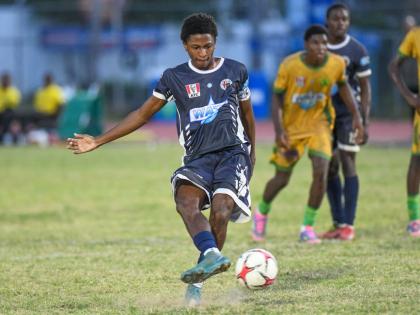 Jamaica College’s Dontae Logan scores from the penalty spot during yesterday’s Manning Cup match against St Jago High at Ashenheim Stadium. Jamaica College won 2-1.