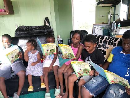 
Students make the most of their temporary classroom, learning and laughing under the guidance of Elaine Morgan.