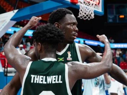 Courtesy of www.fiba.basketball/en 
Jamaica’s Andrew Thelwell congratulates Kofi Cockburn after the centre converted a rebound to upset the hosts Puerto Rico in their FIBA World Cup Group B qualification opener 92-90 inside the Coliseo Roberto Clemente i
