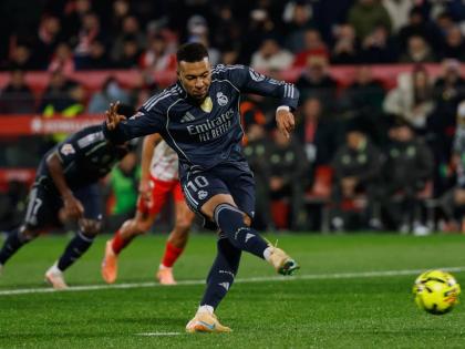 Real Madrid’s Kylian Mbappe scores a penalty kick during a Spanish La Liga match between Girona and Real Madrid, in Girona, Spain, yesterday.