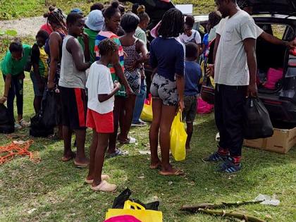 Residents of Giddy Hall, St Elizabeth receive care packages from Give Back Jamaica following Hurricane Melissa.