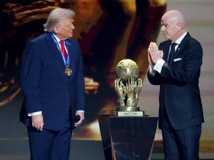 FIFA President Gianni Infantino (right) awards President Donald Trump with the FIFA Peace Prize during the draw for the 2026 football World Cup at the Kennedy Center in Washington yesterday.