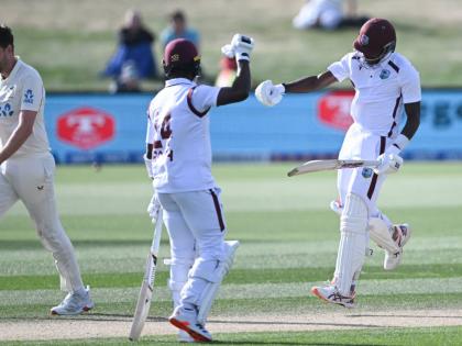 
West Indies’ Justin Greaves (right) celebrates with teammate Kemar Roach (centre) after scoring 200 runs against New Zealand on day five of their Test match in Christchurch, New Zealand, on Friday. 