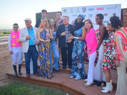 
The consortium of women who own RIDEALLDAY share the spotlight with the Mouttet Mile trophy it won at the first time of the asking at Caymanas Park yesterday.