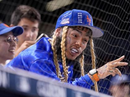  Rapper Tekashi 6ix9ine watches a baseball game between the Miami Marlins and New York Mets, August 3, 2021, in Miami. 