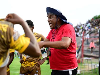 Charlie Smith coach Eugene Williams remonstrates with his charges during an ISSA/WATA Manning Cup fixture.
