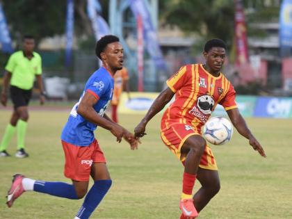 Cornwall College’s Marcane Gooden (right) tries to get the ball under control ahead of Kemps Hill High’s Orlando Campbell in a previous daCosta Cup encounter between the teams at the Montego Bay Sports Complex on October 11. Kemps Hill won yesterday’
