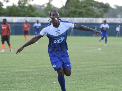 Mount Pleasant Academy's Warner Brown celebrates after scoring against Tivoli Gardens FC during their Jamaica Premier League game at Drax Hall Sports Complex yesterday.