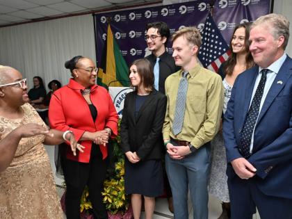 Winnie Berry (left), deputy CEO for curriculum support at the Ministry of Education, Skills, Youth and Information, speaks with Scott Renner (right), Chargé d’Affaires at the US Embassy; Tammy L. Palmer (second left), Peace Corps country director; and v