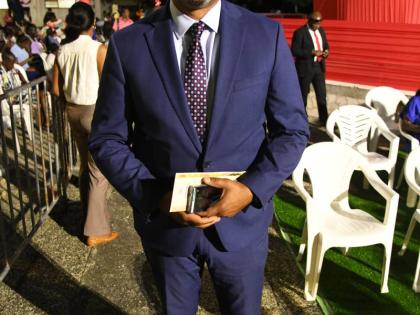 Taking a photo for our lens is Mikael Phillips, member of parliament for Manchester North Western, who represented Opposition Leader Mark Golding.