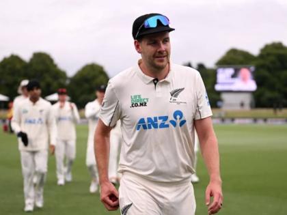 Jacob Duffy leads the team off the field after picking up his second five-wicket haul in Tests against the West Indies.