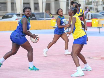 Trishara Monroe (left) of Norman Manley looks for a pass while being guarded by Lashanya Barnes of Gaynstead during an ISSA Urban Netball semi-final at the Leila Robinson Courts on Thursday.