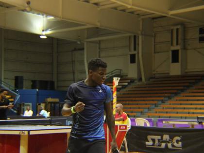 Joel Lamm pumps his fists in celebration of a point in the final of the National Table Tennis Championships against Roberto ‘Magic Dino’ Byles at the National Indoor Sports Centre in September.