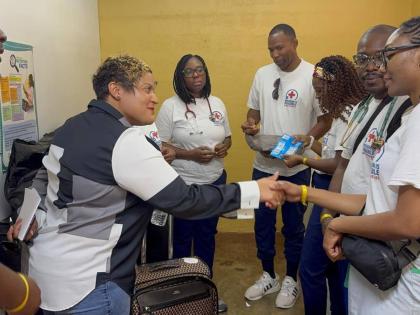 State Minister for Health and Wellness, Krystal Lee, greets members of the medical team that recently provided care to St Ann residents.
