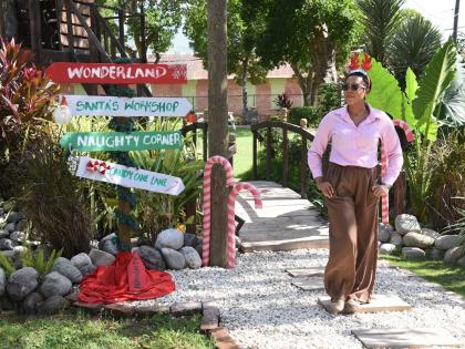 Roshea Masters, public relations manager at Bellevue Hospital, walks through the hospital’s garden, which was decorated for Christmas.