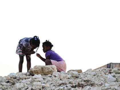 Children play amid the rubble on High Street, Black River, St Elizabeth, following the passage of Hurricane Melissa in October.