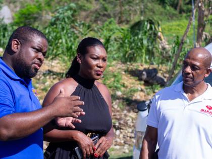 From left: Donmayne Gyles, president and CEO of Andrews Memorial Hospital, makes a point as Zuleika Jess, member of parliament for St Elizabeth North Eastern, and Leroy Dallas, CEO of Allkare Wellness Foundation, listen at an outreach clinic on December 7,