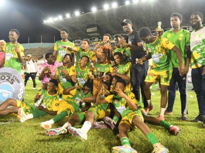 Members of the Excelsior High Manning Cup team celebrate after their win over Jamaica College in the 2025 Manning Cup final at the National Stadium last night.
